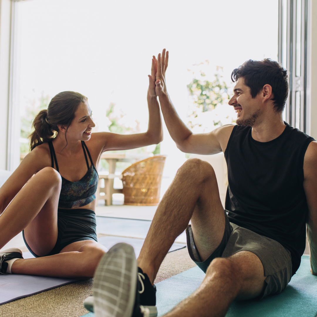 man and woman high five healthy living for prevention